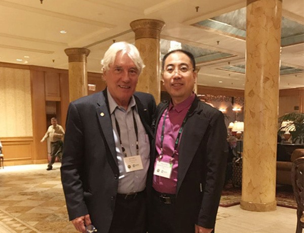 Mr. Zhu took a photo with Mr. Boris, founder of CORTEC